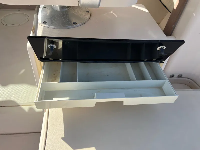 Slide: The Image of Open storage compartment on 1997 Grady-White 232 Gulfstream boat. - 30