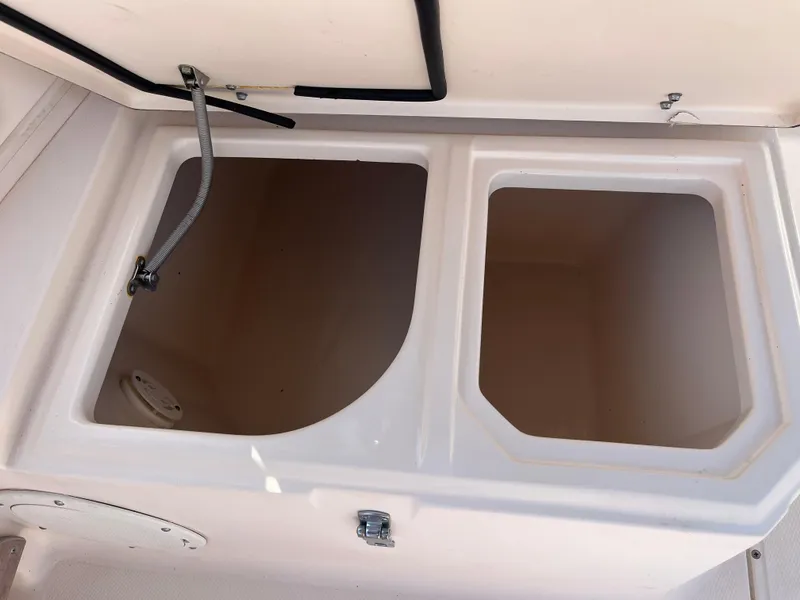 Slide: The Image of Open storage compartments on a 1997 Grady-White 232 Gulfstream boat. - 33