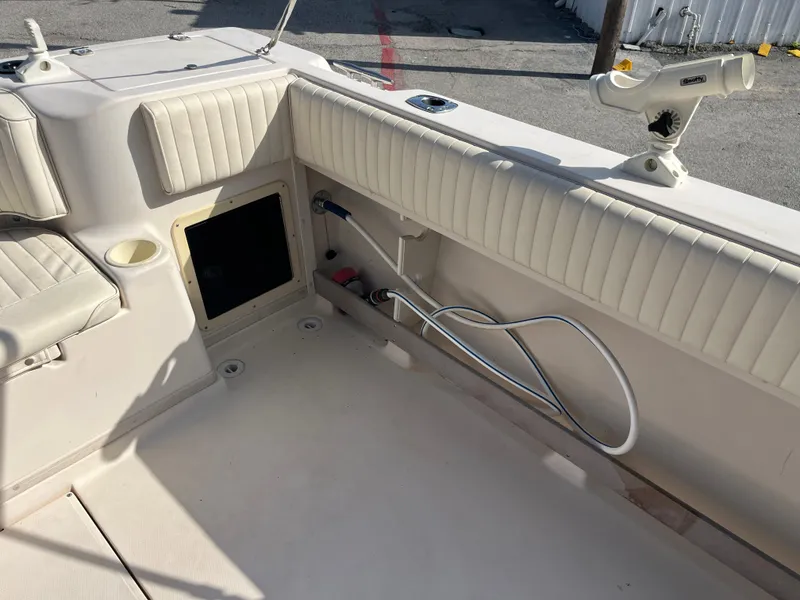 Slide: The Image of 1997 Grady-White 232 Gulfstream boat interior with seating and rod holder. - 35