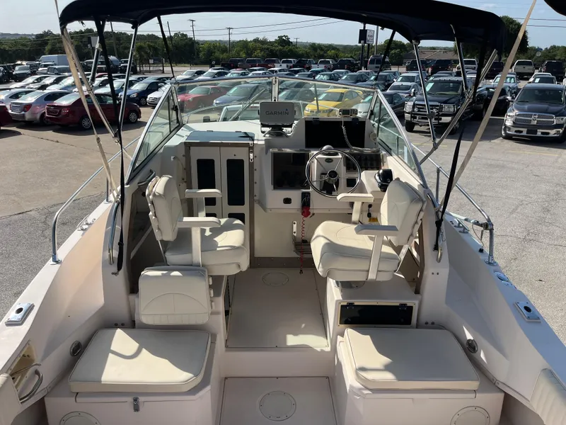 Slide: The Image of 1997 Grady-White 232 Gulfstream boat interior with seating and steering wheel. - 41