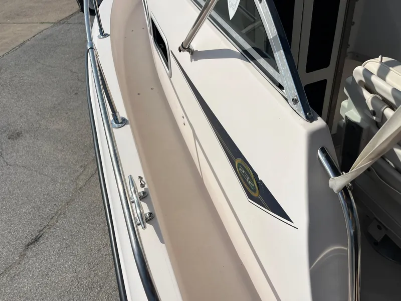 Slide: The Image of 1997 Grady-White 232 Gulfstream boat deck with railing and window detail. - 42