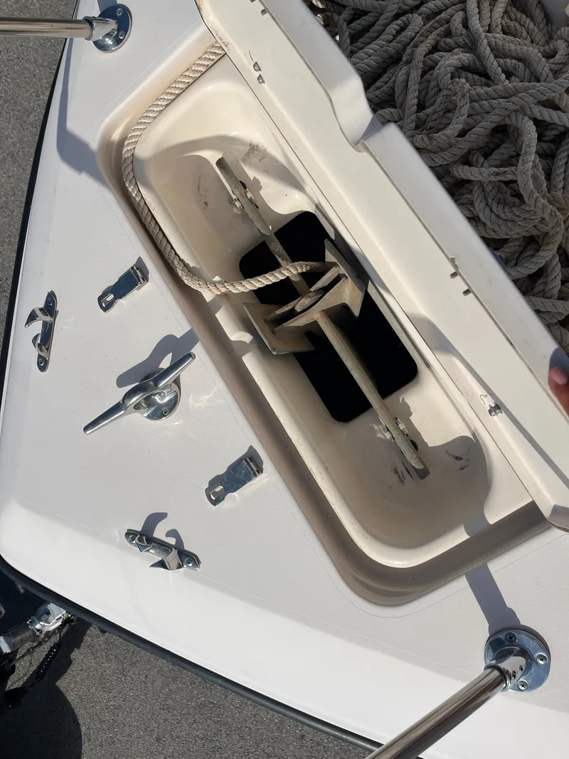 Slide: The Image of Anchor compartment of 1997 Grady-White 232 Gulfstream boat with ropes and fittings. - 44