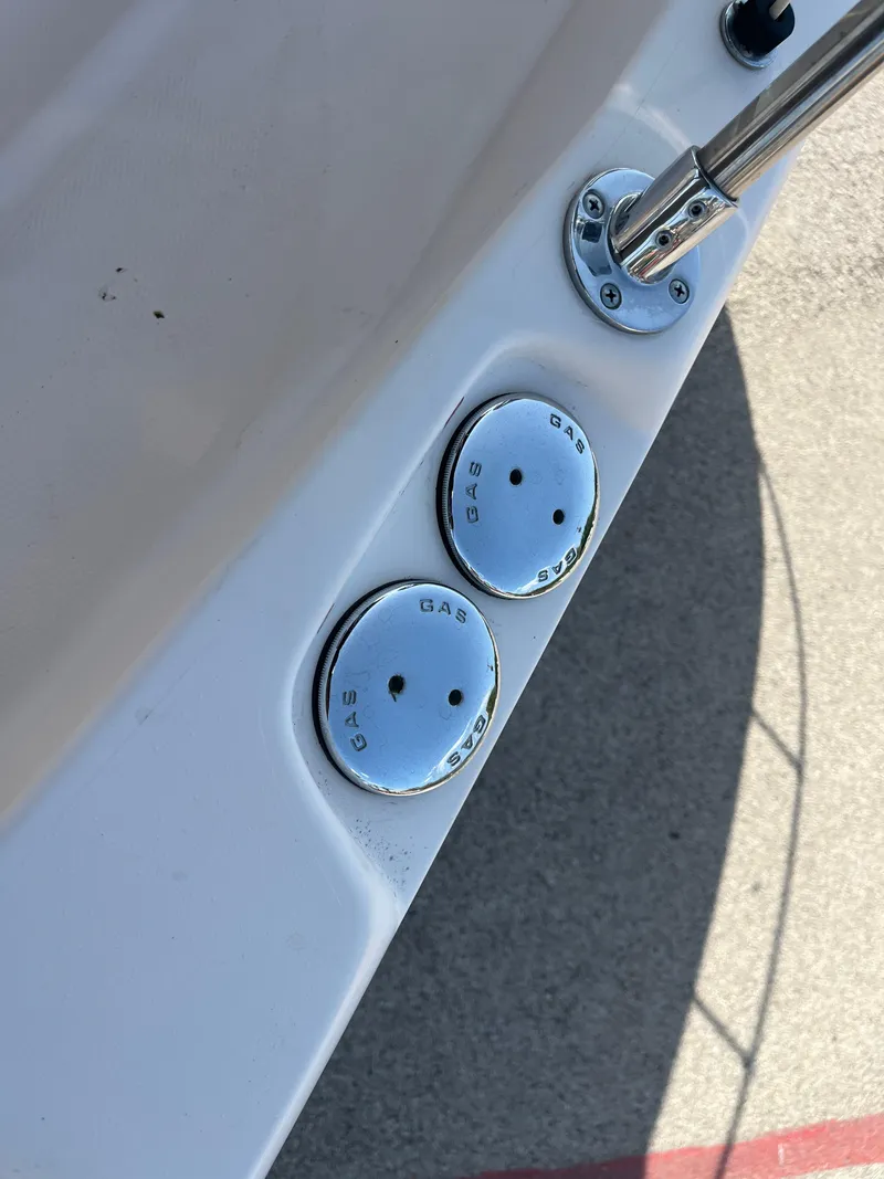 Slide: The Image of 1997 Grady-White 232 Gulfstream boat gas caps and fittings on deck. - 46