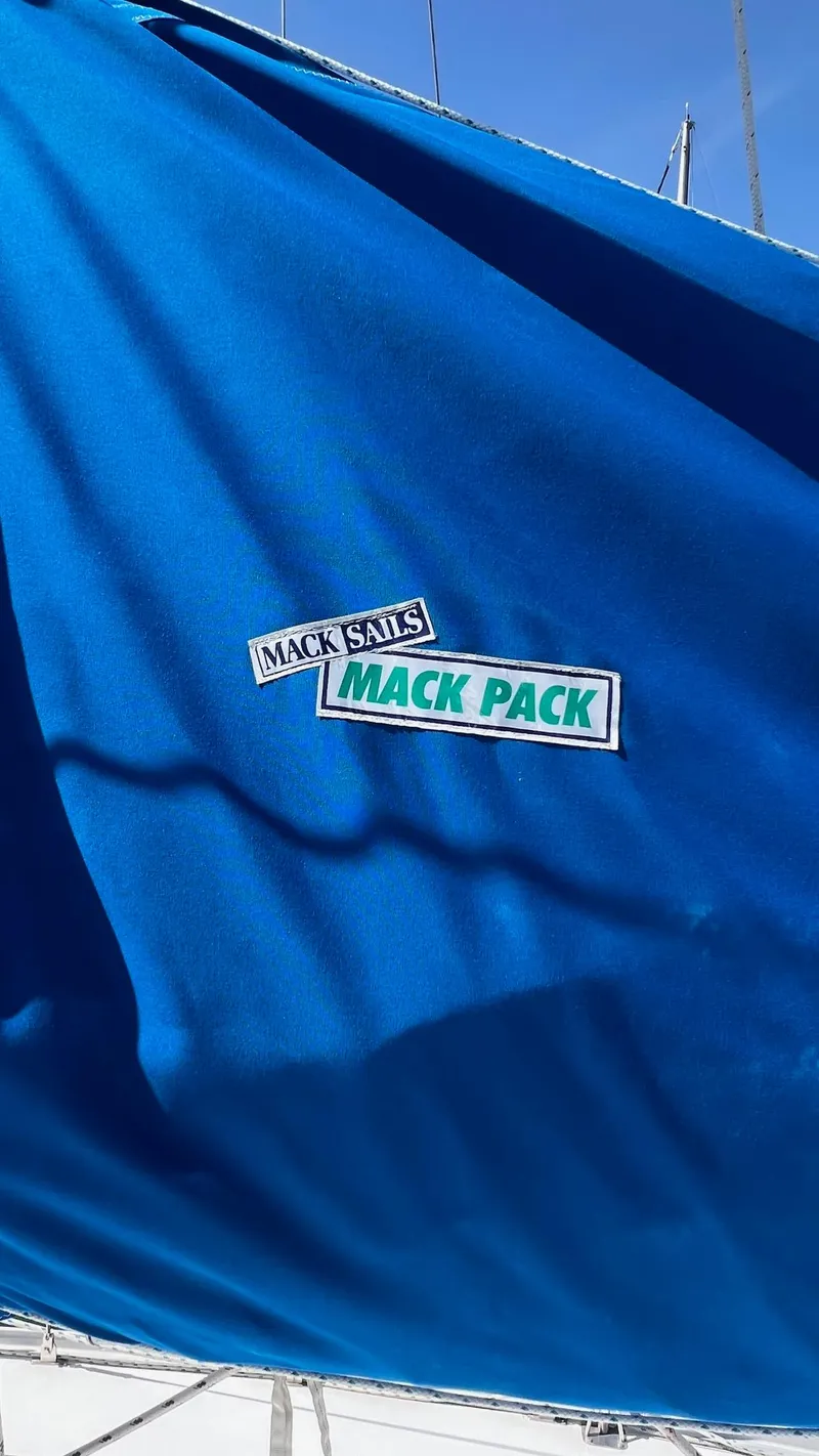 Slide: The Image of Blue sail cover with "Mack Sails Mack Pack" label on Endeavour 32' Sloop, 1976. - 13