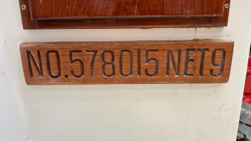 Slide: The Image of Wooden plaque with "NO. 578015 NET 9" on a 1976 Endeavour 32' Sloop. - 22