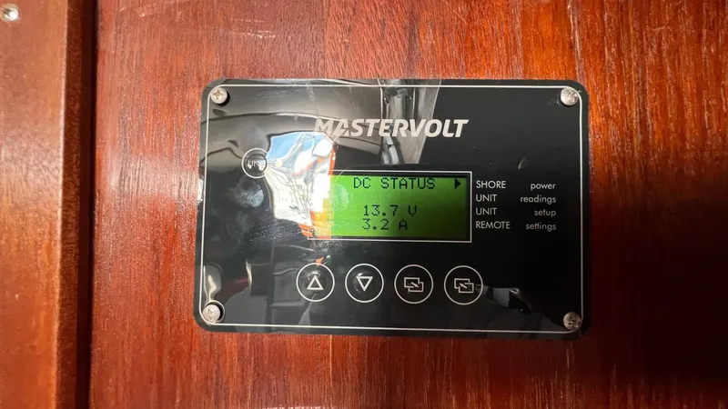 Slide: The Image of Mastervolt control panel on 1976 Endeavour 32' Sloop, displaying DC status. - 25