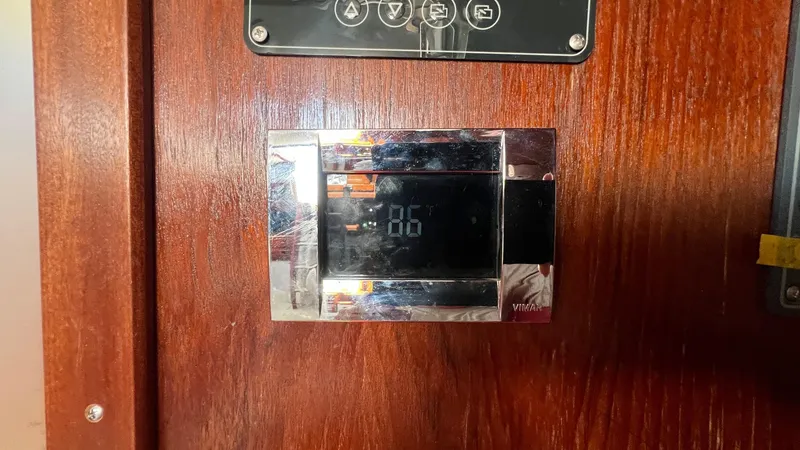 Slide: The Image of Digital thermostat on wooden panel of 1976 Endeavour 32' Sloop. - 26