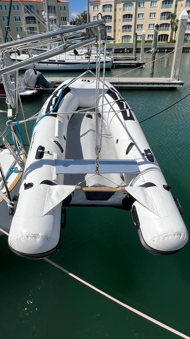 Slide: The Image of Inflatable dinghy on Endeavour 32' Sloop, 1976, docked in marina. - 5