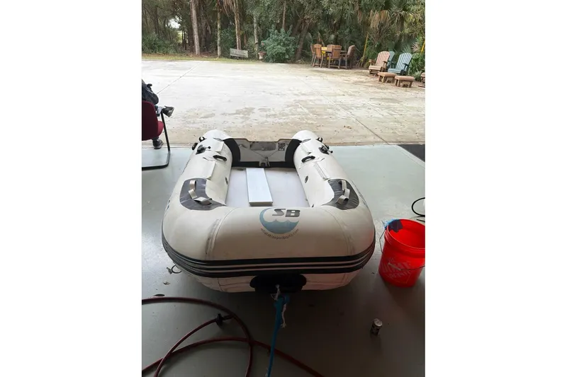 Slide: The Image of Inflatable boat in garage, near Endeavour 32' Sloop, 1976 model. - 50