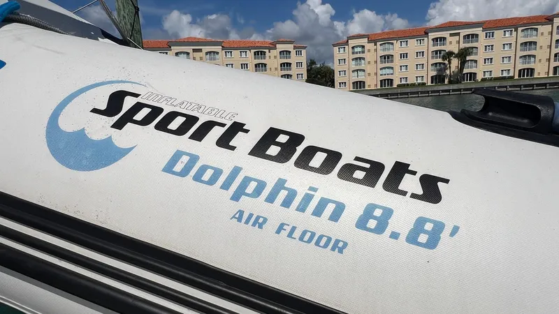 Slide: The Image of Inflatable Sport Boats Dolphin 8.8' with air floor, near waterfront buildings. - 6
