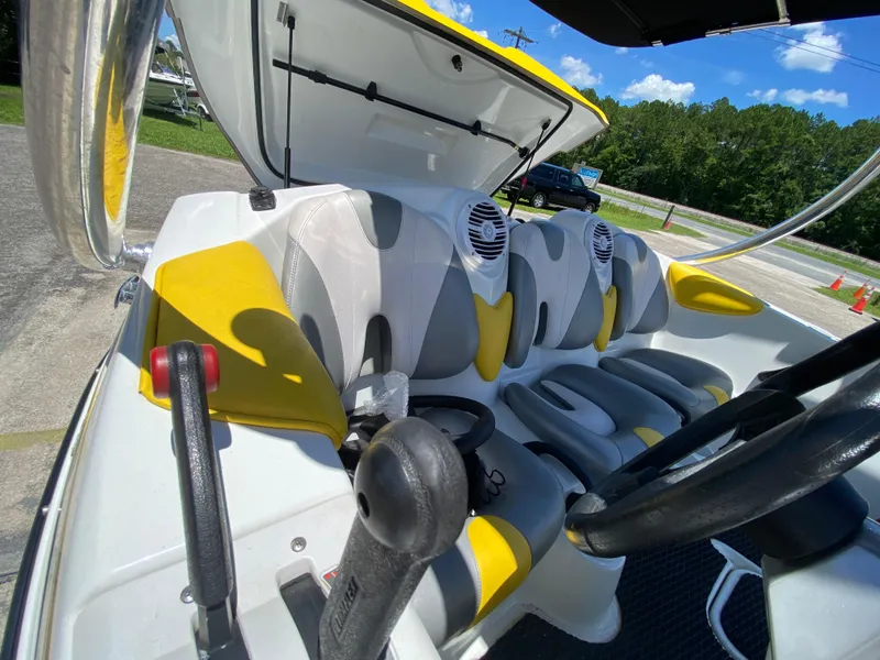Slide: The Image of 2006 Sea-Doo Sportster interior with yellow accents, steering wheel, and seating. - 13