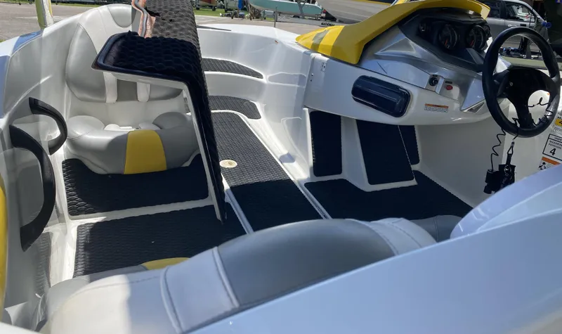 Slide: The Image of 2006 Sea-Doo Sportster 15' interior with yellow accents and steering wheel. - 3