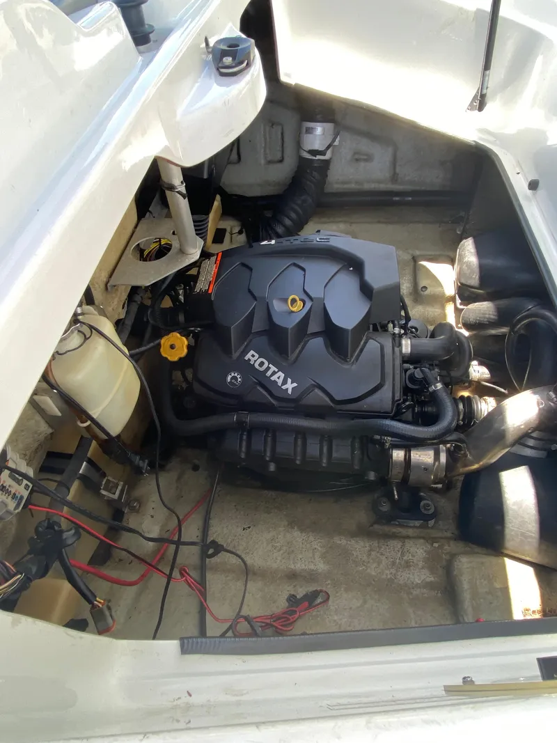 Slide: The Image of 2006 Sea-Doo Sportster engine compartment with Rotax engine, showing detailed components and wiring. - 8