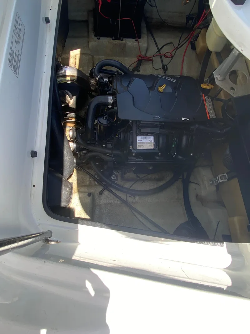 Slide: The Image of 2006 Sea-Doo Sportster engine compartment, showcasing internal components and wiring. - 9