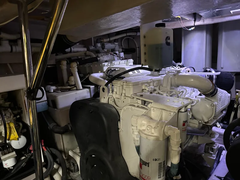 Slide: The Image of Engine room of a 2016 Sea Ray L590 yacht, showcasing mechanical components and systems. - 20
