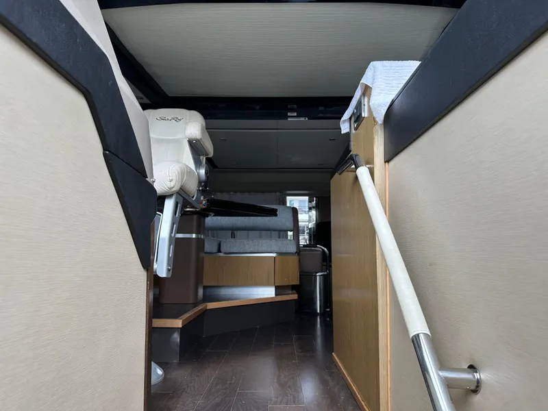 Slide: The Image of Interior view of 2016 Sea Ray L590 yacht, featuring modern seating and sleek design elements. - 26