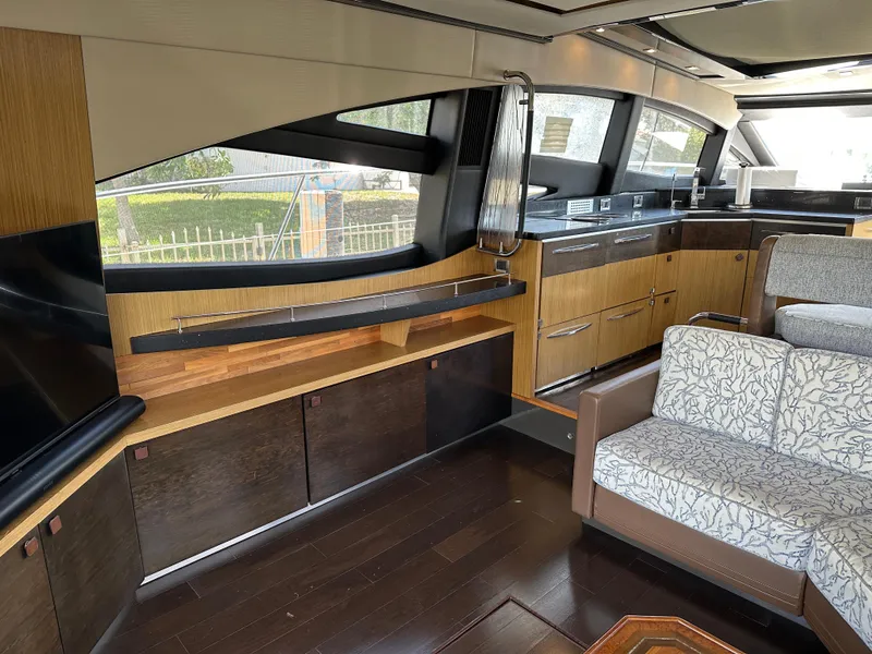 Slide: The Image of Luxurious interior of 2016 Sea Ray L590 yacht with modern kitchen and comfortable seating. - 34