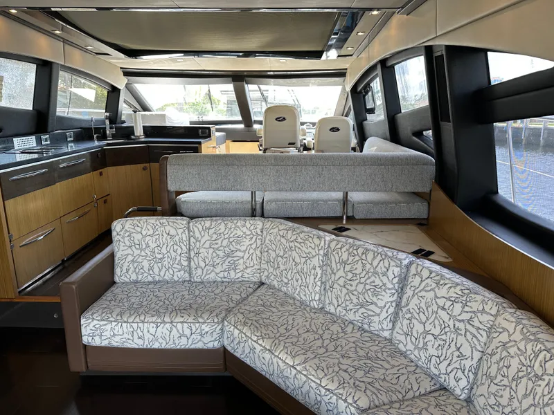 Slide: The Image of Luxurious interior of a 2016 Sea Ray L590 yacht with elegant seating and modern kitchen. - 35