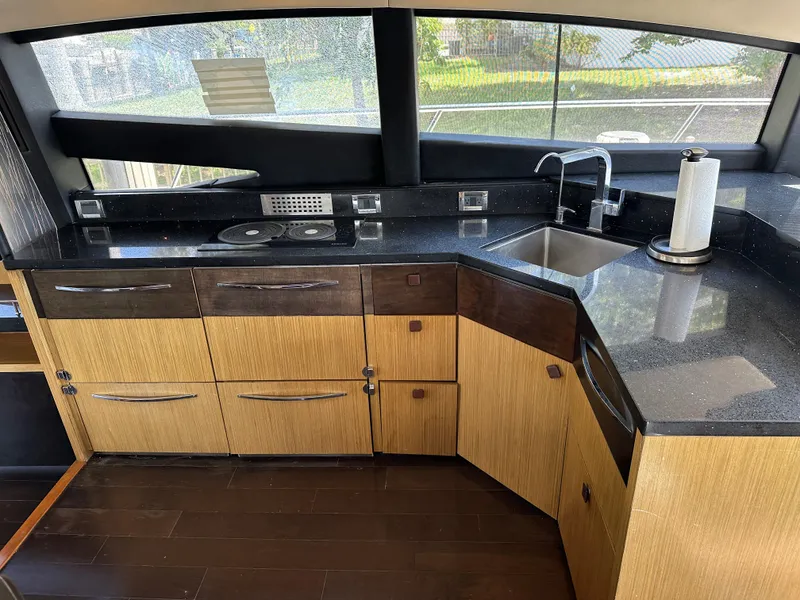 Slide: The Image of Luxurious kitchen interior of 2016 Sea Ray L590 yacht with modern appliances and sleek design. - 39