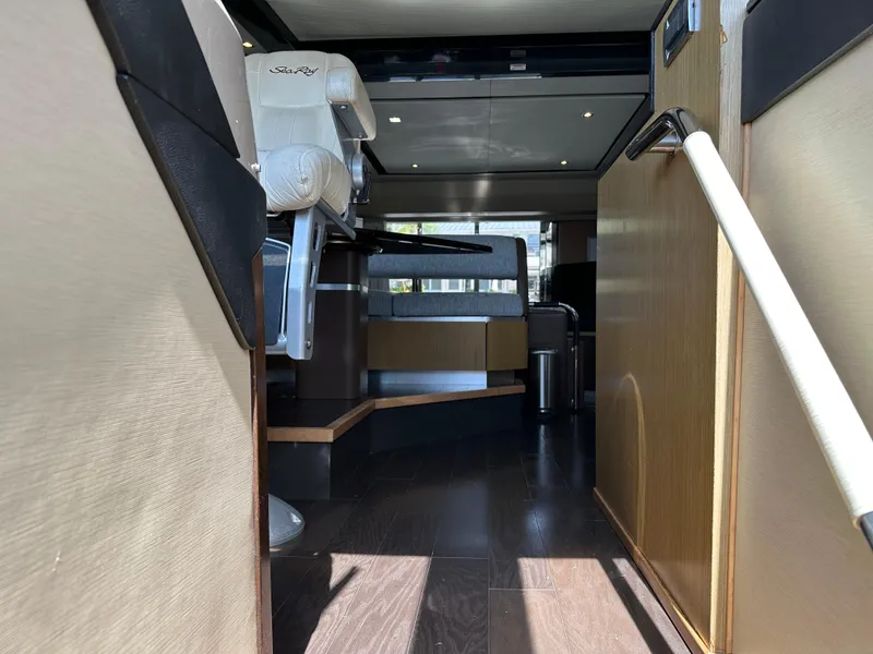 Slide: The Image of Interior view of 2016 Sea Ray L590 yacht, featuring luxurious seating and modern design. - 4