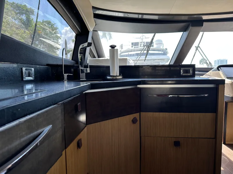 Slide: The Image of Luxurious interior of 2016 Sea Ray L590 yacht kitchen with modern fixtures and cabinetry. - 41