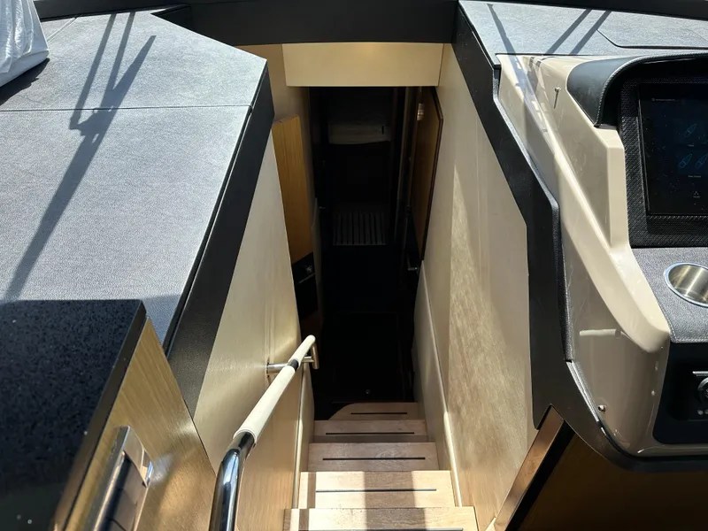 Slide: The Image of Interior stairs of 2016 Sea Ray L590 yacht, featuring sleek design and modern materials. - 42