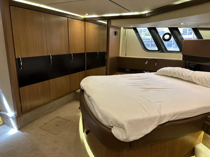 Slide: The Image of Luxurious bedroom interior of 2016 Sea Ray L590 yacht with modern wood finishes. - 46