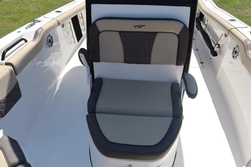 Slide: The Image of 2022 Tidewater 272 LXF boat interior with cushioned seating and sleek design. - 10