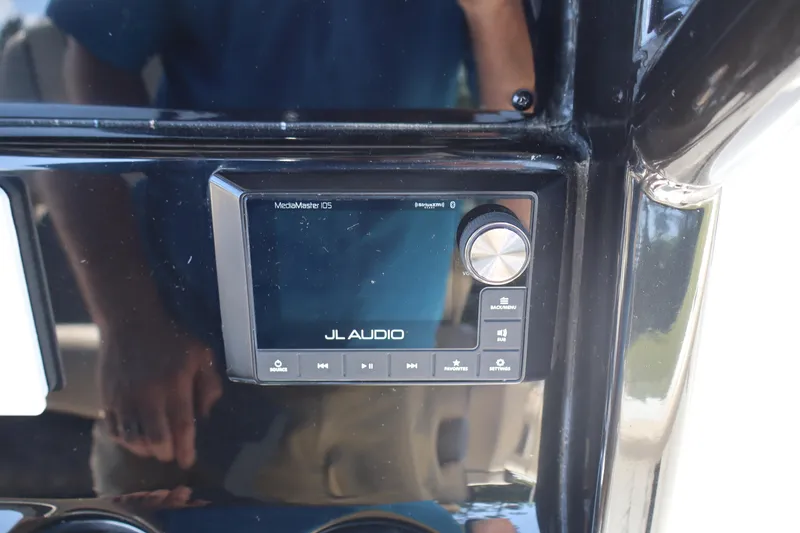 Slide: The Image of JL Audio MediaMaster 105 on 2022 Tidewater 272 LXF boat dashboard. - 23