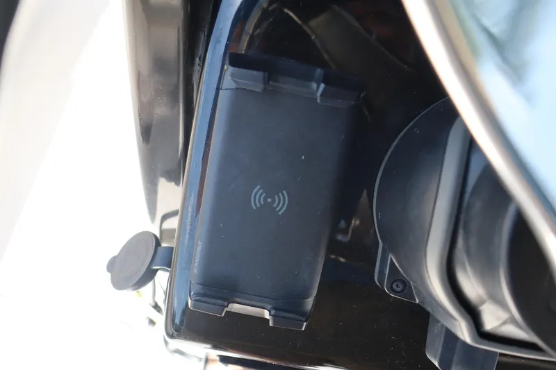 Slide: The Image of Wireless charging pad on 2022 Tidewater 272 LXF boat dashboard. - 24