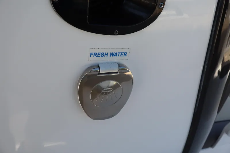 Slide: The Image of 2022 Tidewater 272 LXF boat fresh water access point. - 26