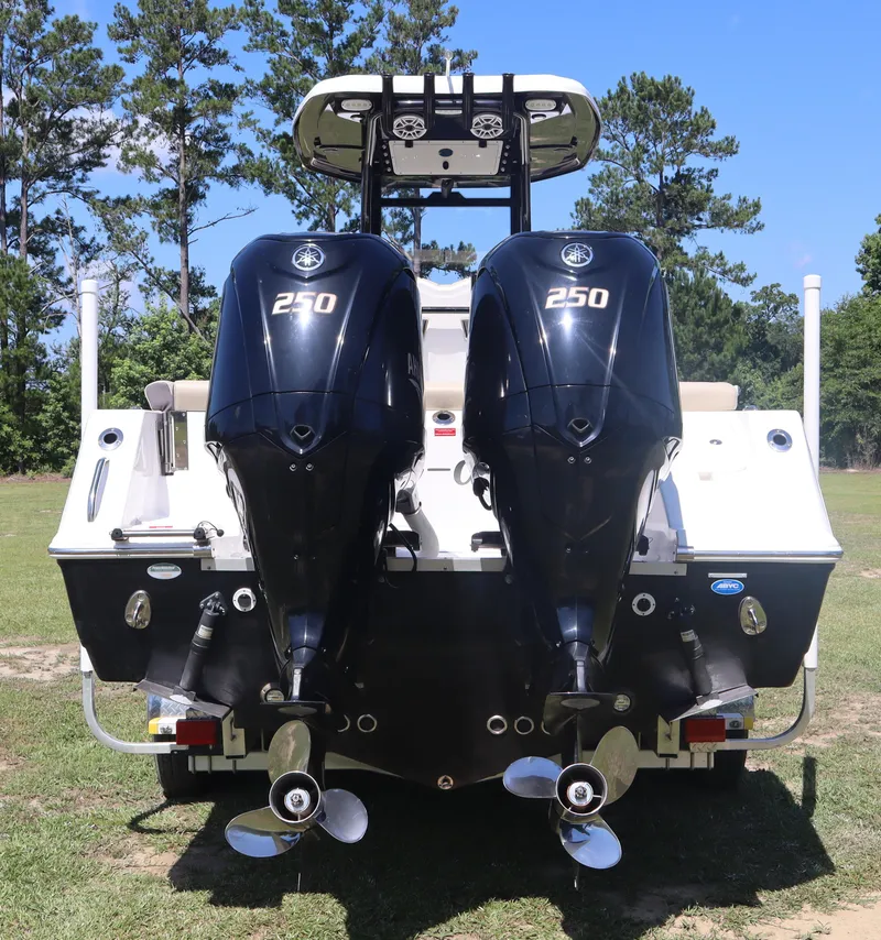 Slide: The Image of 2022 Tidewater 272 LXF boat with dual 250 horsepower engines, rear view. - 5