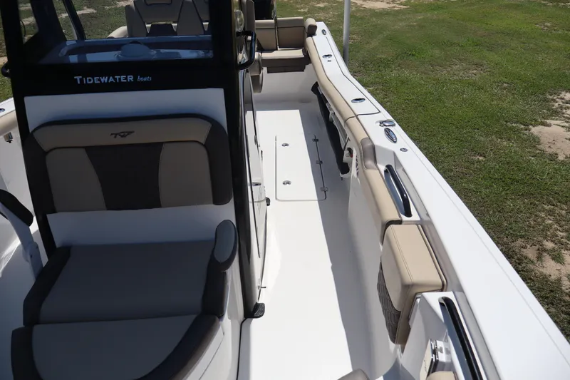 Slide: The Image of 2022 Tidewater 272 LXF boat interior with cushioned seating and sleek design. - 8