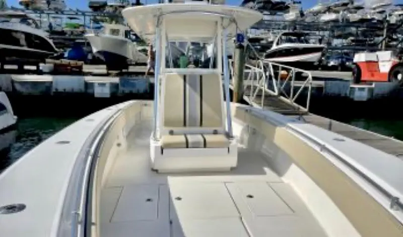 Slide: The Image of 2008 Contender 36 Open boat docked at marina, showcasing spacious deck and seating. - 14