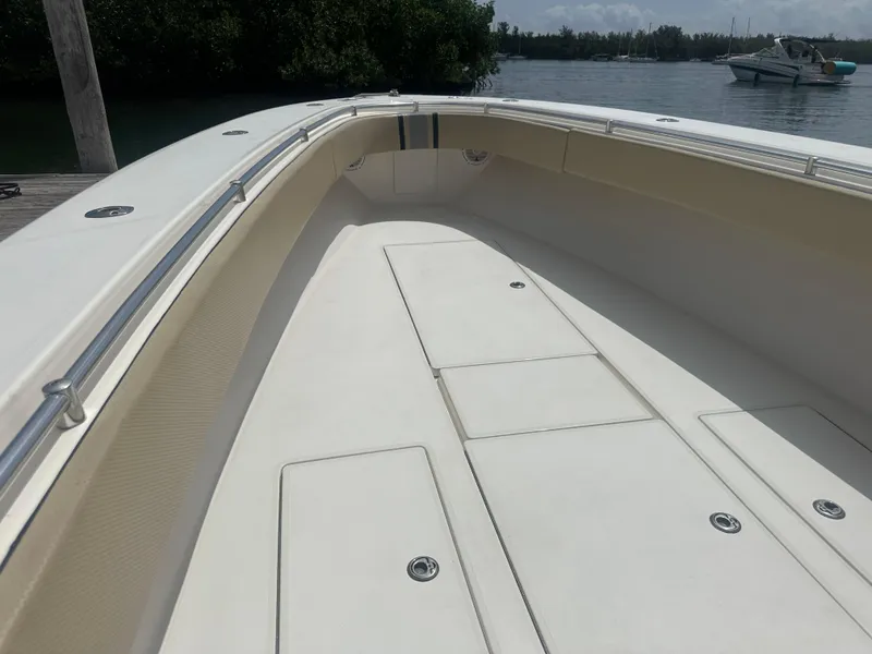 Slide: The Image of 2008 Contender 36 Open boat deck, spacious and sleek design, docked by the water. - 15