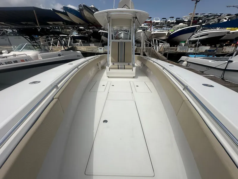 Slide: The Image of 2008 Contender 36 Open boat docked, showcasing spacious deck and sleek design. - 17