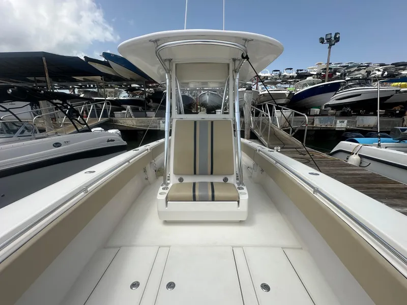 Slide: The Image of 2008 Contender 36 Open boat at marina, showcasing spacious deck and seating. - 18