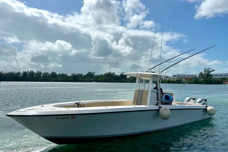 Slide: The Image of 2008 Contender 36 Open boat on calm water under a partly cloudy sky. - 2