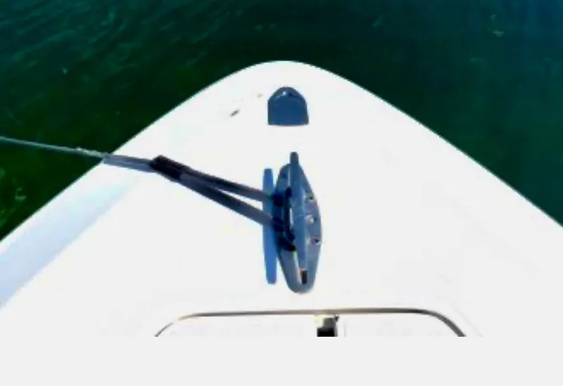 Slide: The Image of Bow of 2008 Contender 36 Open boat with cleat and rope on water. - 20