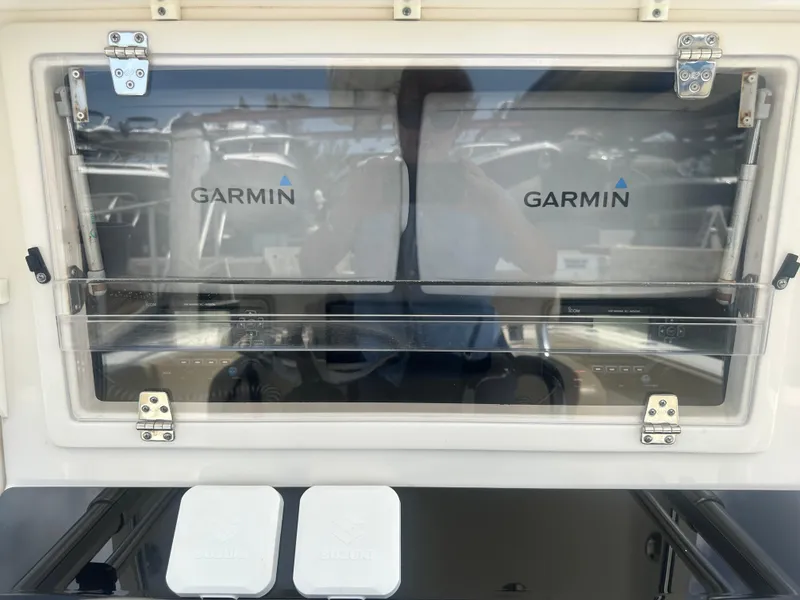 Slide: The Image of 2008 Contender 36 Open boat dashboard with Garmin navigation system. - 26