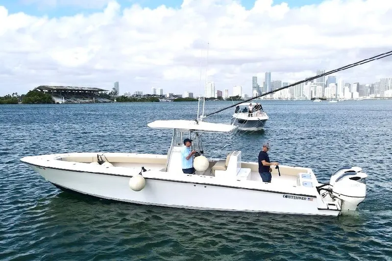 Slide: The Image of 2008 Contender 36 Open boat on water with city skyline in background. - 3