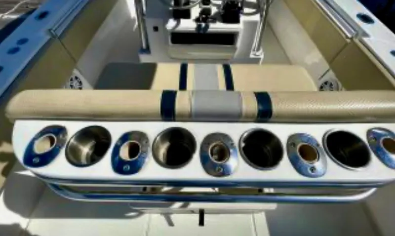 Slide: The Image of 2008 Contender 36 Open boat interior with rod holders and cushioned seating. - 32