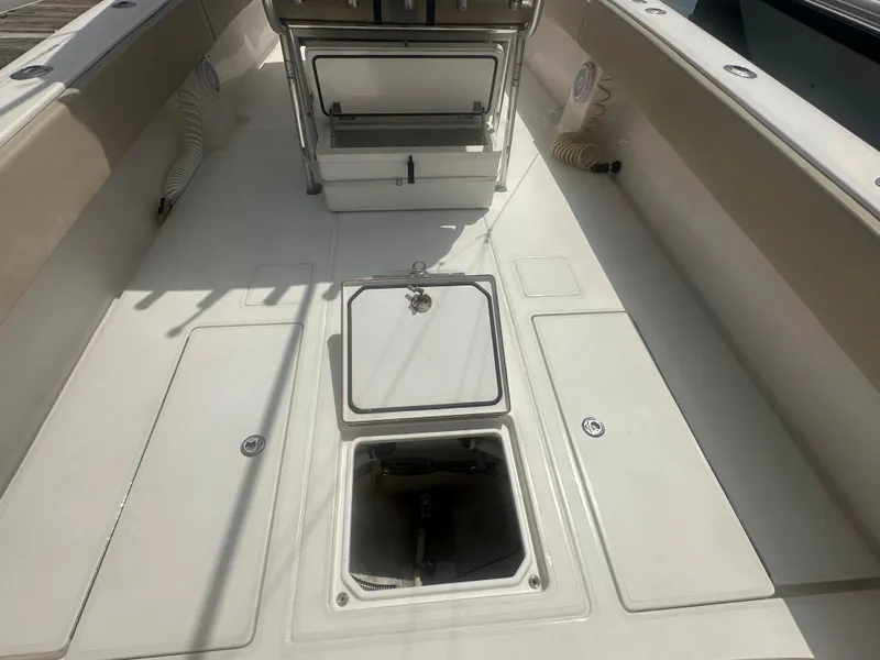 Slide: The Image of 2008 Contender 36 Open boat deck with storage compartments and seating. - 33