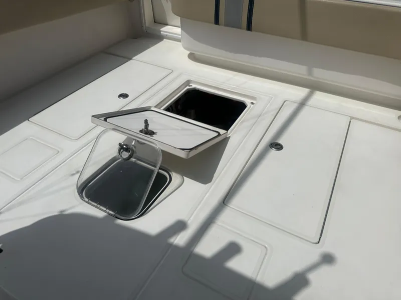 Slide: The Image of 2008 Contender 36 Open boat deck with open storage compartments. - 36