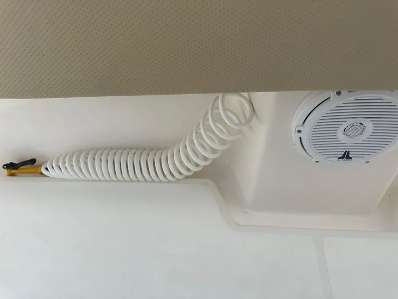 Slide: The Image of Coiled hose and speaker on 2008 Contender 36 Open boat ceiling. - 37