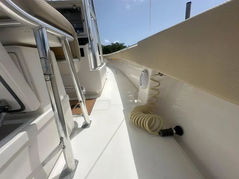 Slide: The Image of 2008 Contender 36 Open boat interior with coiled hose and stainless steel railing. - 39