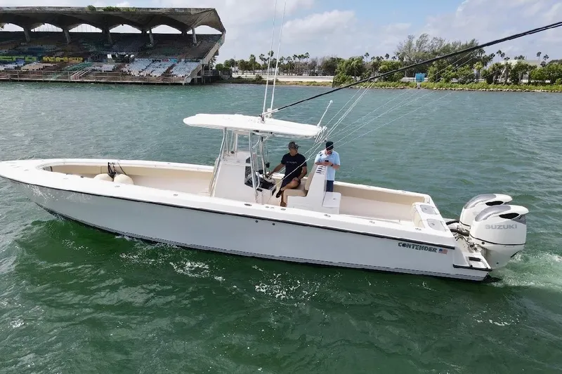 Slide: The Image of 2008 Contender 36 Open boat with Suzuki engines on the water. - 4