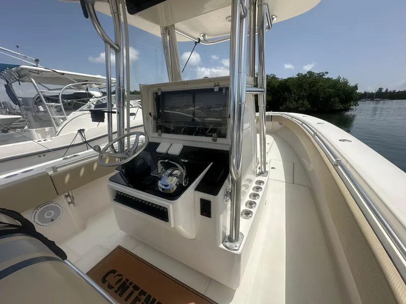 Slide: The Image of 2008 Contender 36 Open boat interior with steering console and navigation equipment. - 40