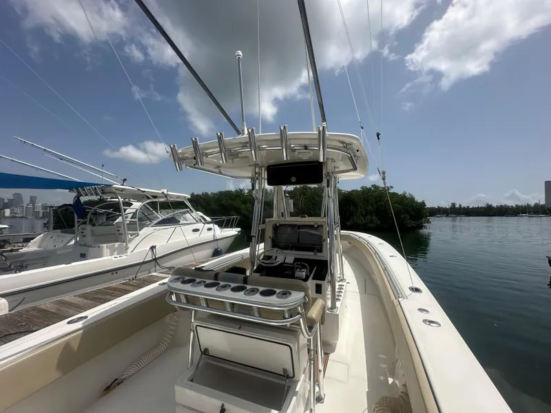 Slide: The Image of 2008 Contender 36 Open boat docked, featuring a sleek design and spacious deck. - 41