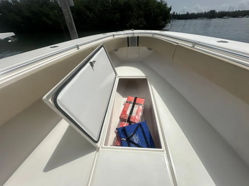 Slide: The Image of 2008 Contender 36 Open boat with open storage compartment, docked by the water. - 42